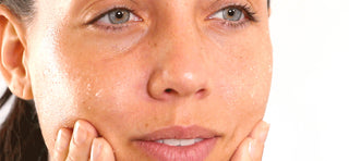 Woman with Glowing Skin After Using STEM CELLULAR Exfoliating Peel Spray
