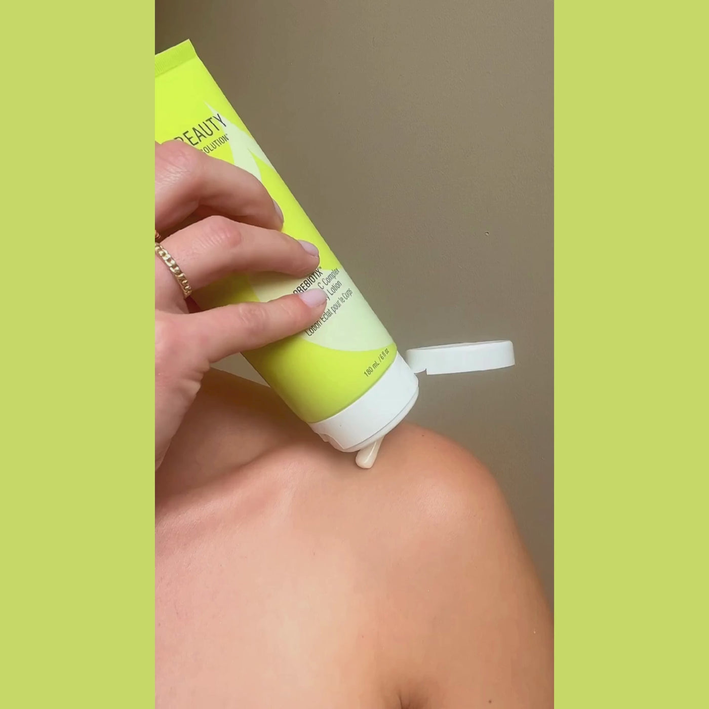 Woman Using Juice Beauty PREBIOTIX™ 10% Vitamin C Complex Glow Body Lotion