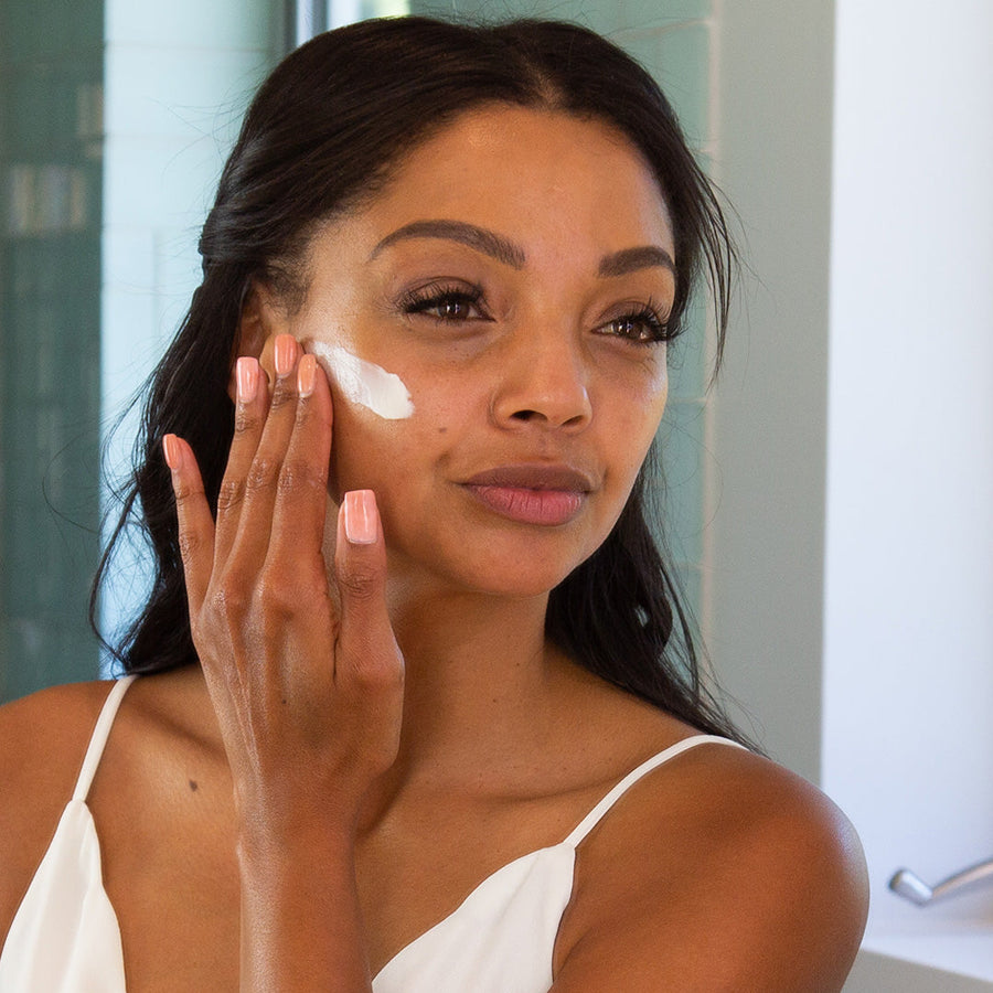 Woman using PREBIOTIC Cleansing Cream