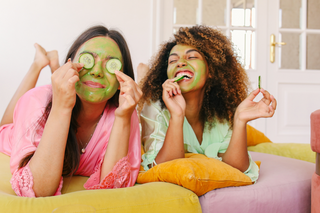 Two Women Doing Face Masks Together at Home