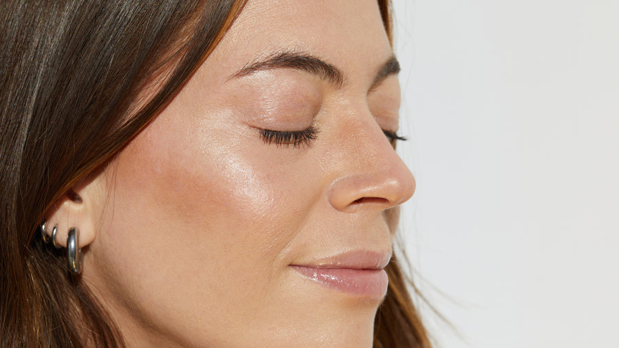 Woman Wearing PREBIOTIX Sheer Glow SPF 45 Multi-tasking Moisturizer