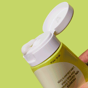 PREBIOTIX 10% Vitamin C Complex Glow Body Lotion Being Squeezed From Tube