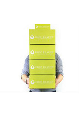 Juice Beauty Boxes Being Carried by a Member of our Fulfillment Team