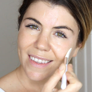 Woman Applying the GREEN APPLE Peel Sensitive Exfoliating Mask