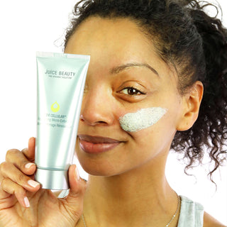Woman Using and Holding a STEM CELLULAR Resurfacing Micro-Exfoliant